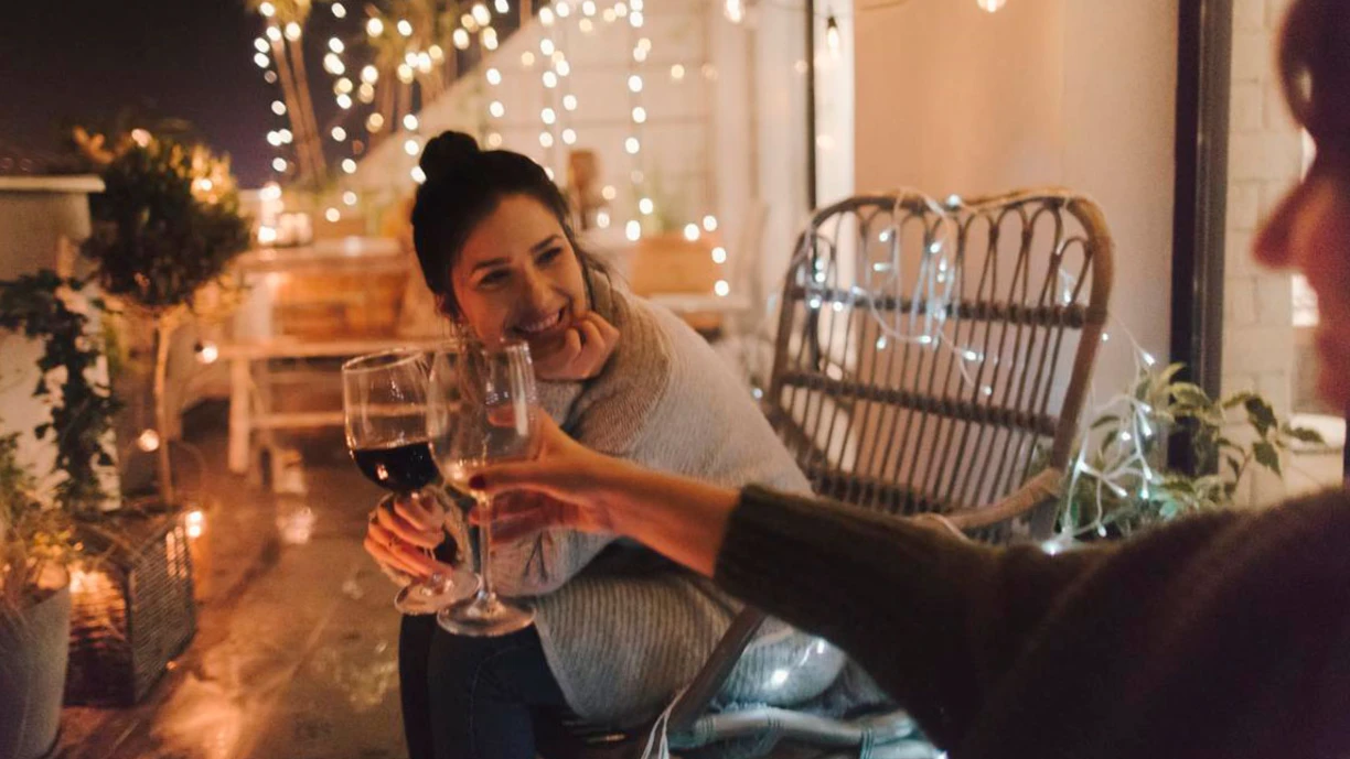 Women_drinking_wine_together_in_a_cozy_enviornment