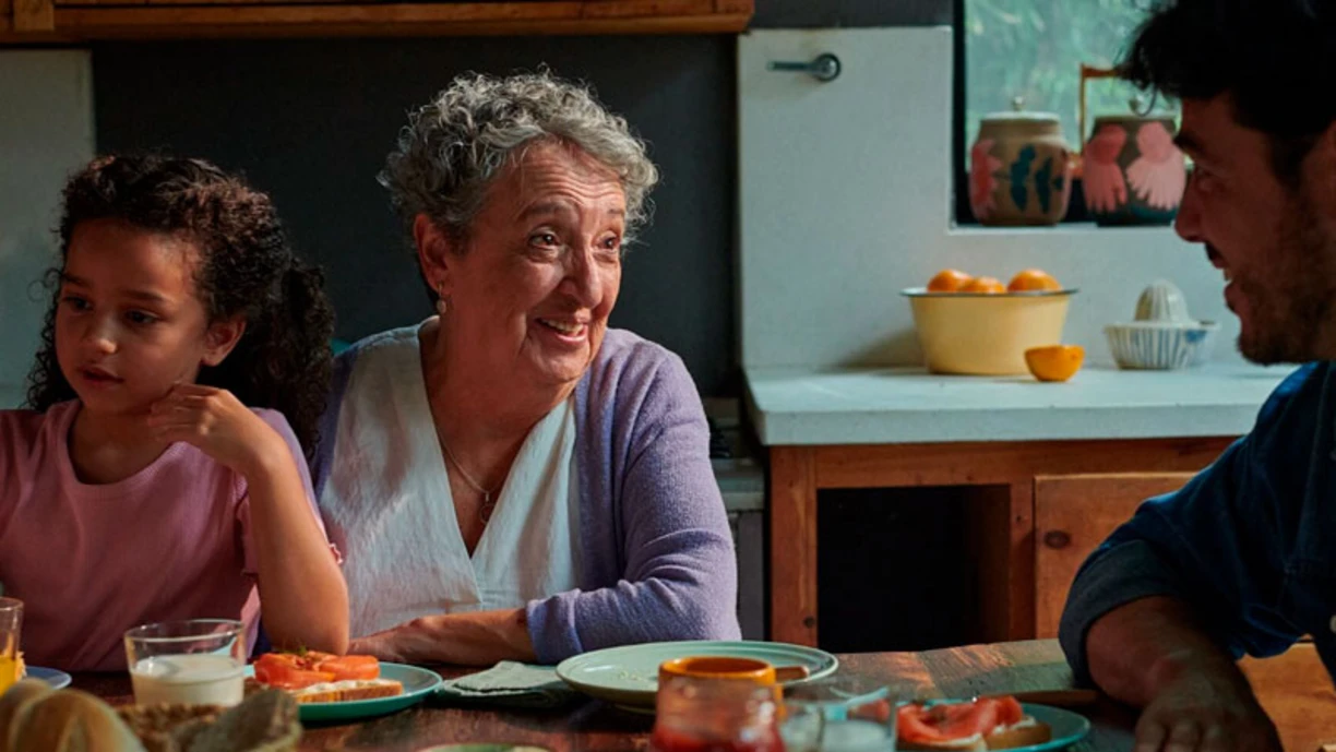 A family sitting by breakfast table