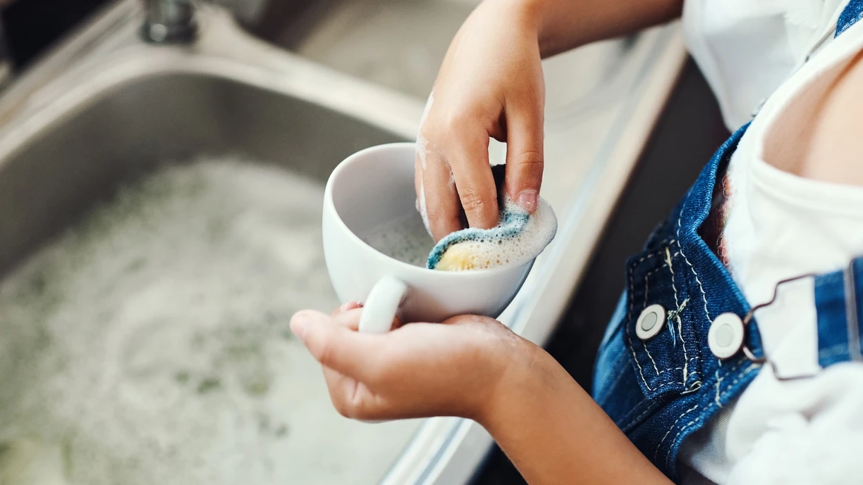 hand washing a cup