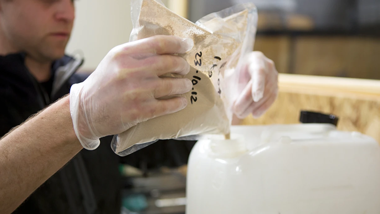 brewery technician mixing powdered yeast
