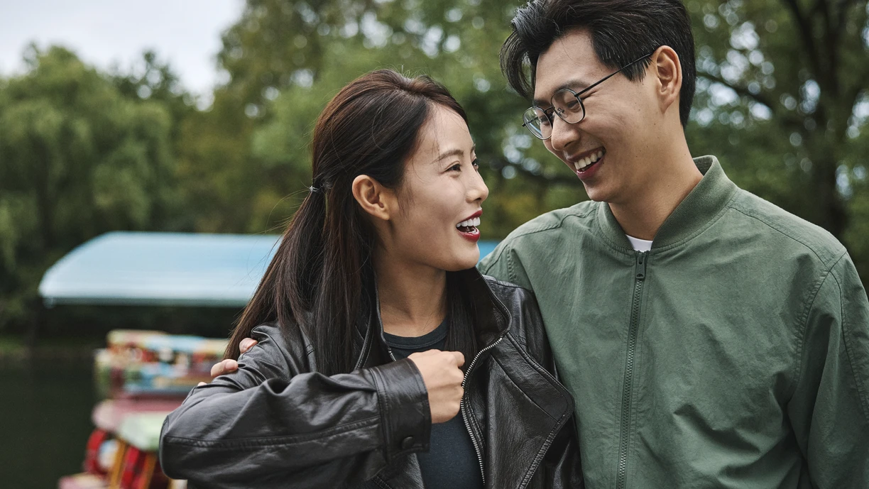 Couple laughing and walking