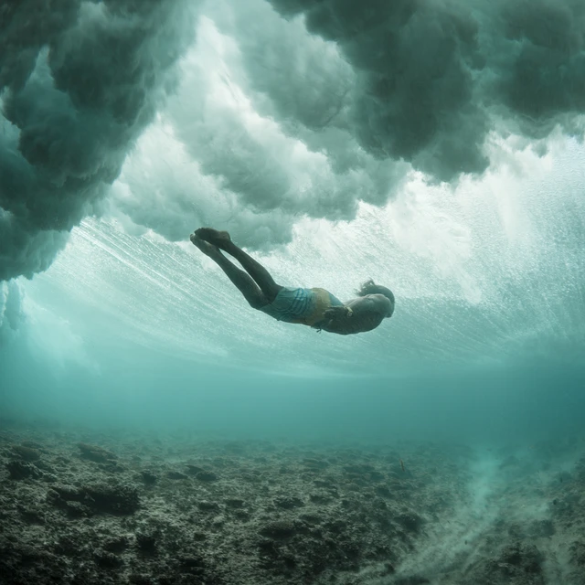 Man diving into wave