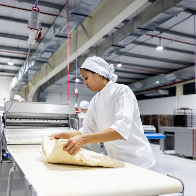 Woman_in_factory_making_dough