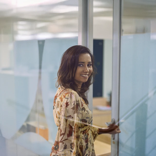 Girl_smiling_to_camera_from_side_angle