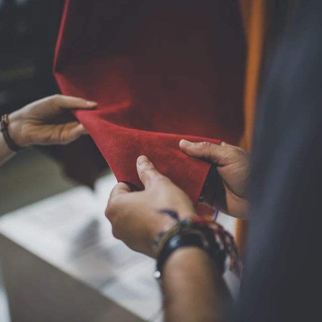 Hands touching leather