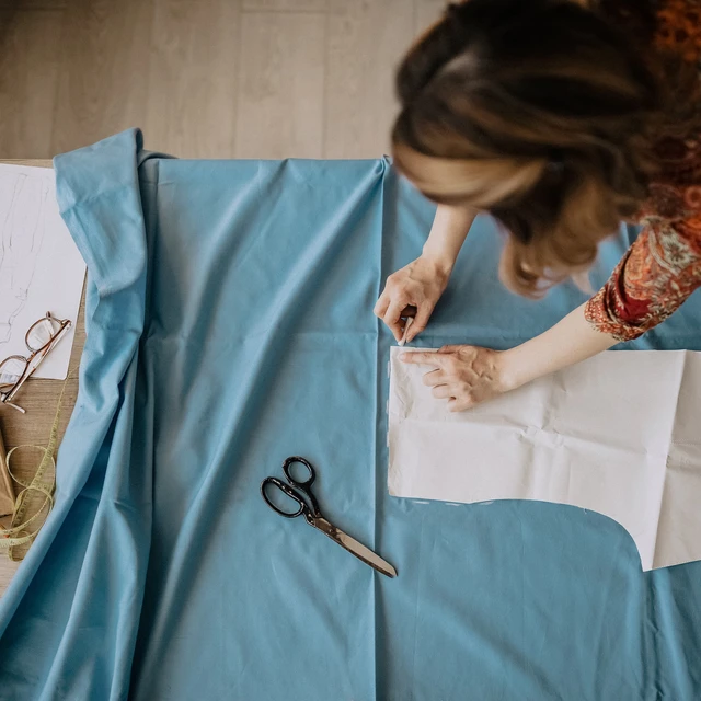 Woman cutting fabric