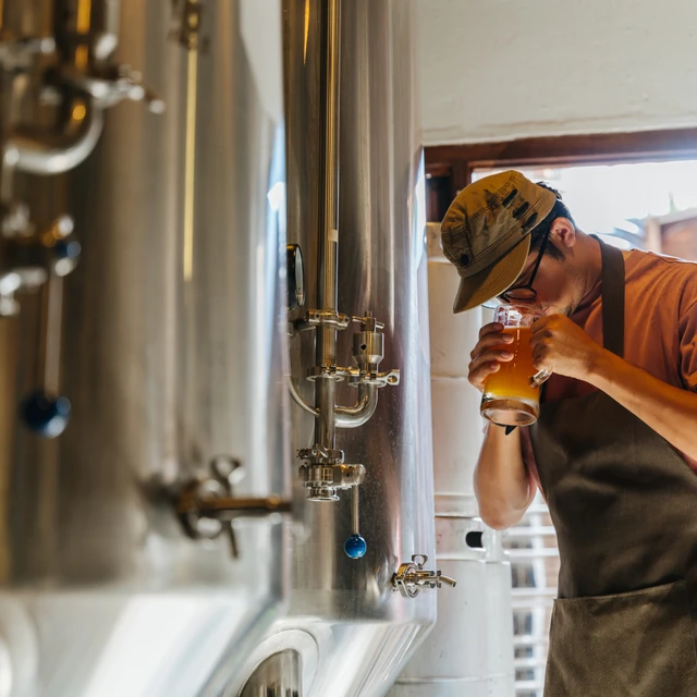 Brewer smelling beer