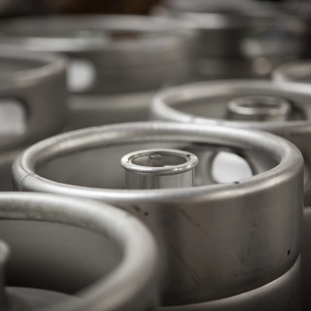 Closeup of steel barrels with beer