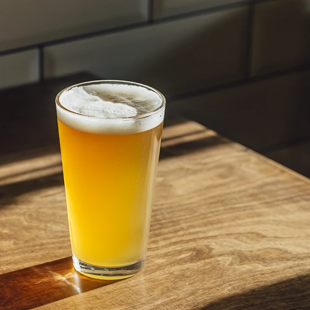 Beer on a wooden table light from window