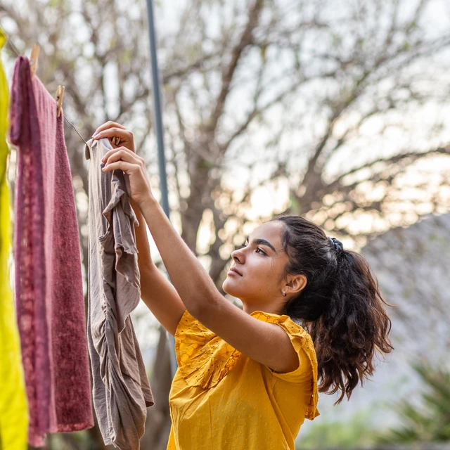 Woman hanging up clothes
