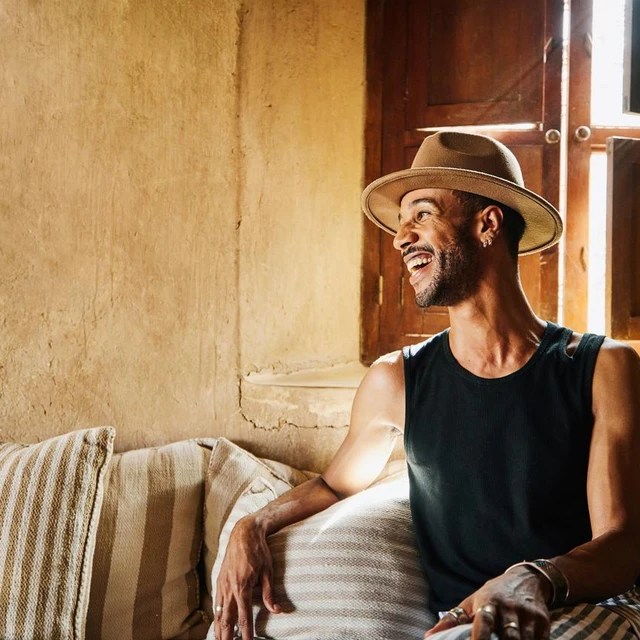 man-hat-laughing-couch