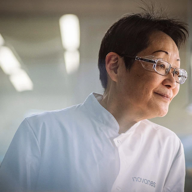Scientist in a lab coat working in a modern lab, representing research and innovation