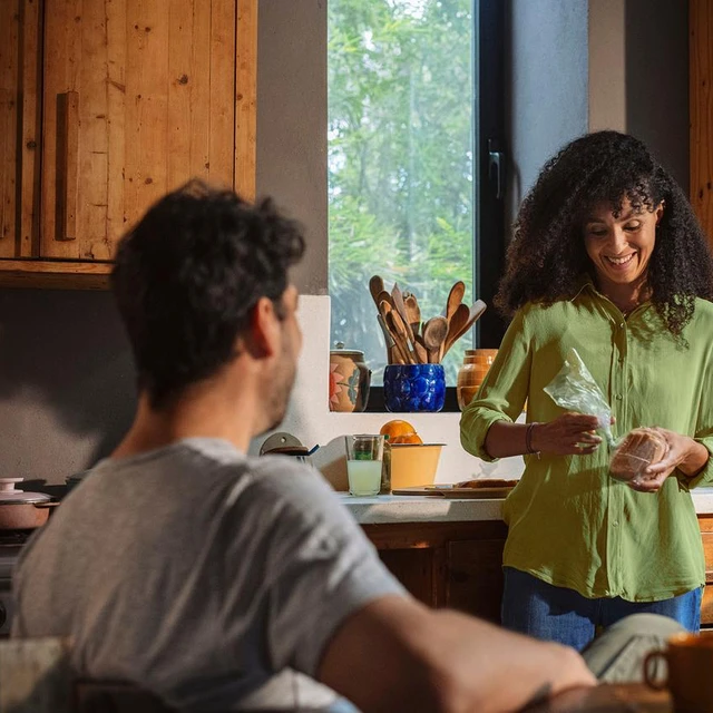 people smiling eating packaged bread