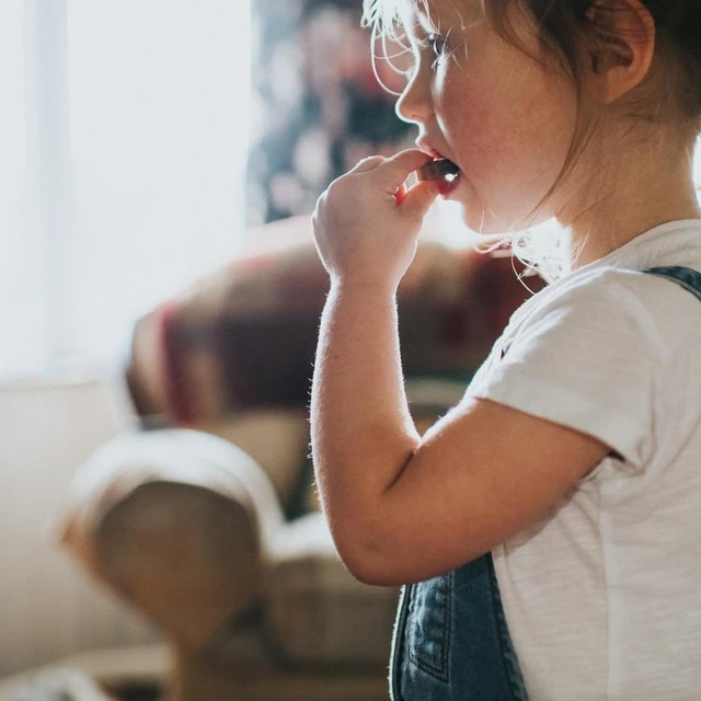 girl eating gummy