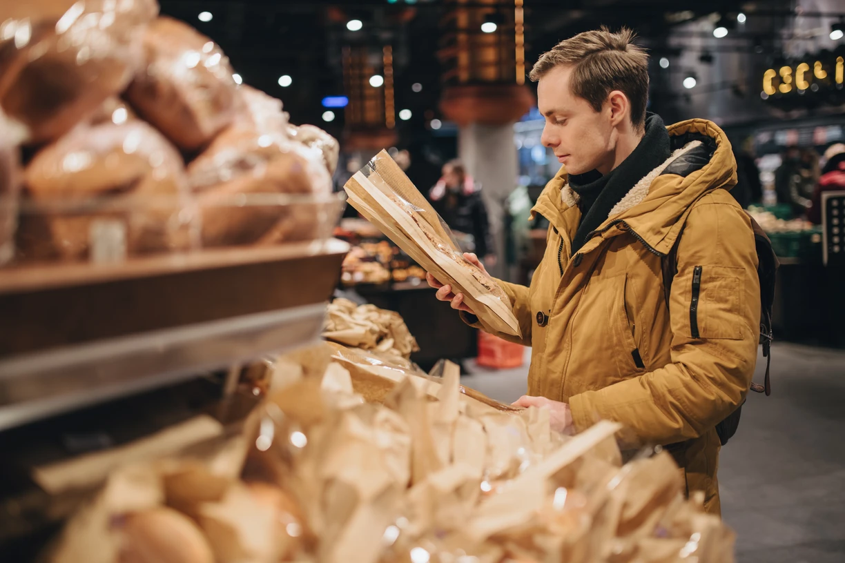 Man_with_in-store_bakery_bread_in_the_supermarket
