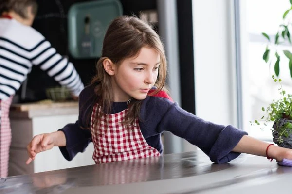 girl cleaning surface