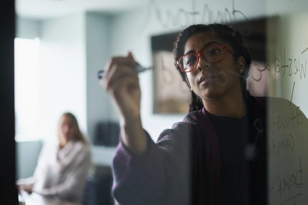Woman writing on window