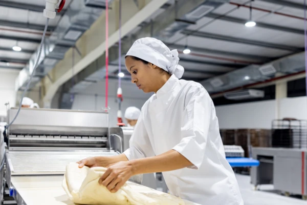 Woman_in_factory_making_dough