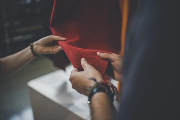 Hands touching leather