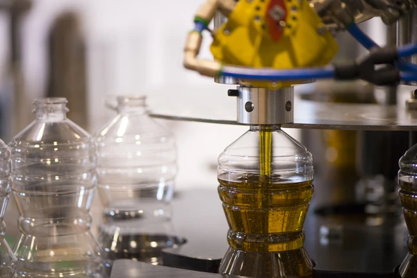 Oil bottle being filled up