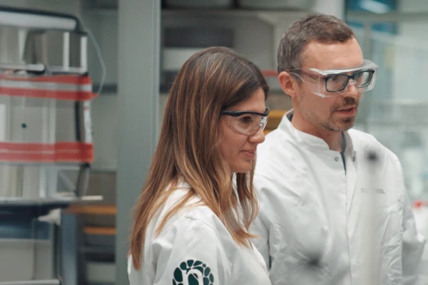 Girl and guy in laboratory in glasses