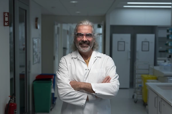 Scientist with a smile standing in a lab