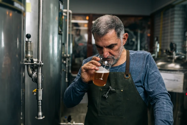 Brewer tasting beer
