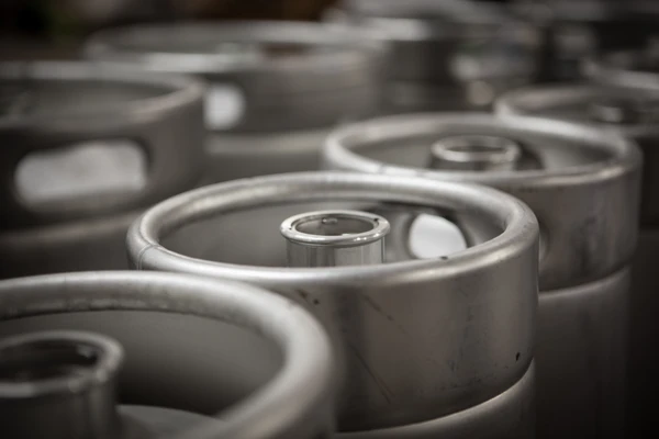 Closeup of steel barrels with beer