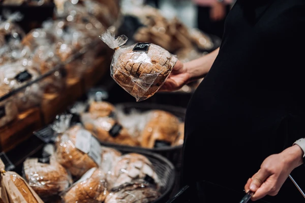 Woman buying bread