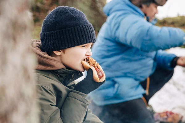 boy eating hotdog