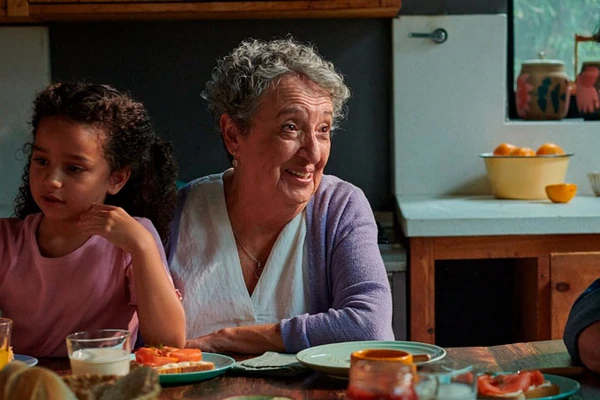 A family sitting by breakfast table