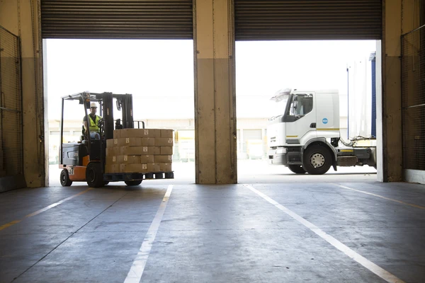 Forklift truck unloading a lorry