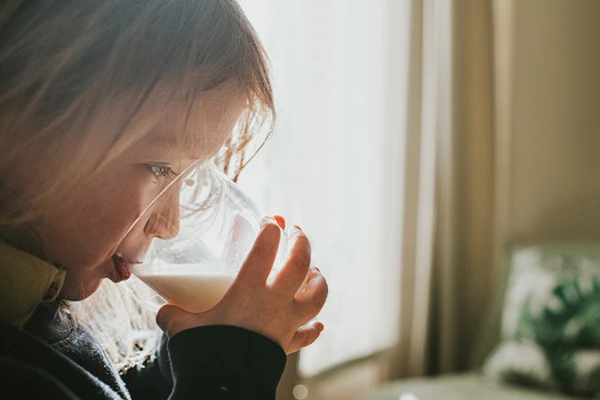 A girl drinking milk