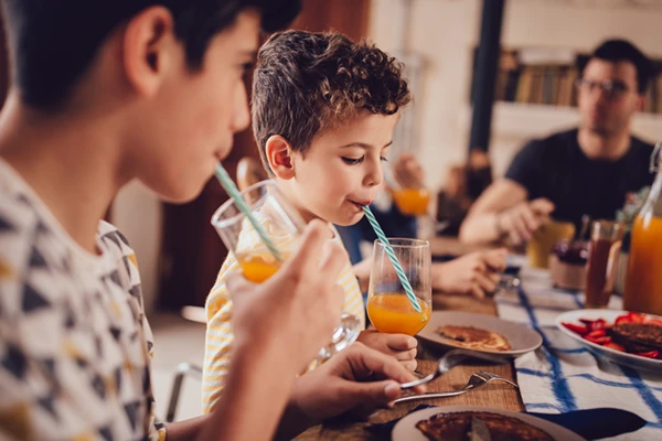 A group of kids drinking juices