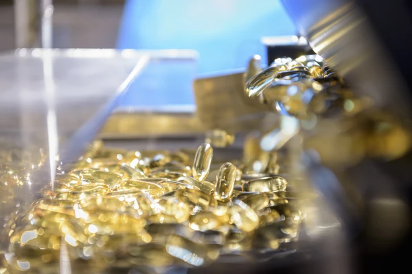 Fish oil pills being made in a factory