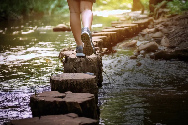 feet walking across river
