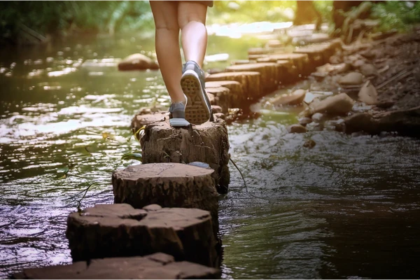 stepping over river