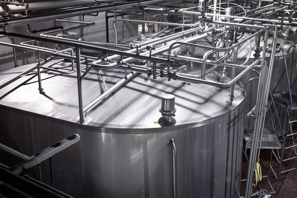 Large steel tanks in a dairy plant 