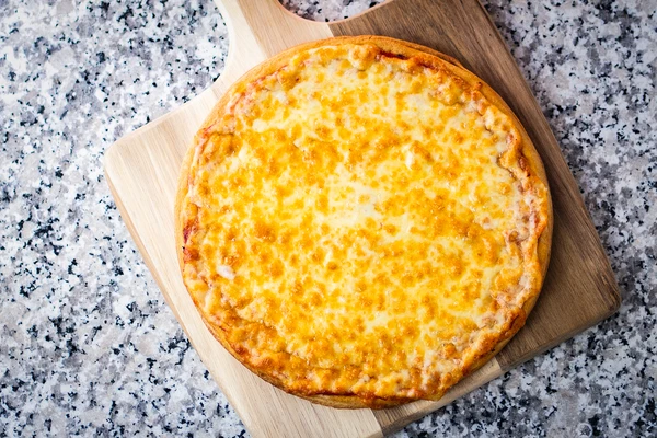 Margherita pizza on a wooden board 