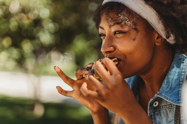 Woman eating plant based burger
