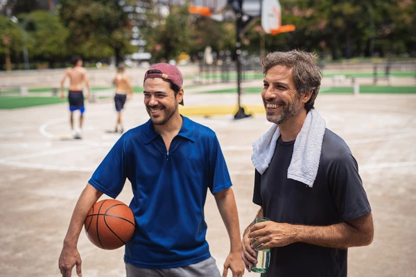 men in basketball park