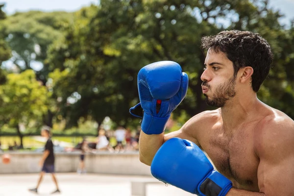 High intensity training athlete with boxing gloves