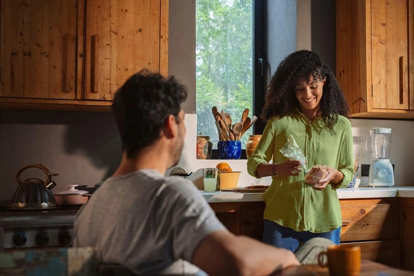 people smiling eating packaged bread