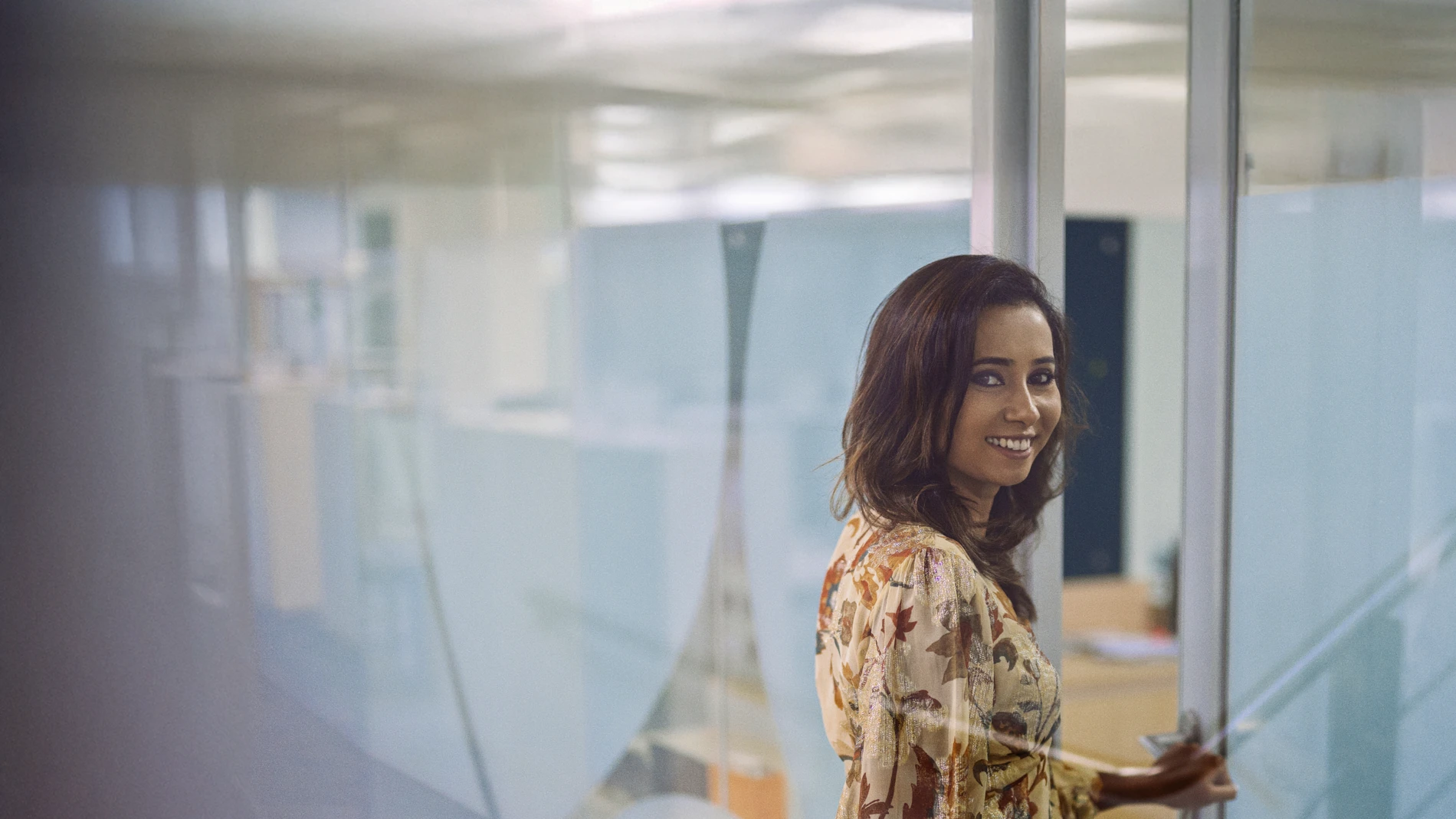 Girl_smiling_to_camera_from_side_angle