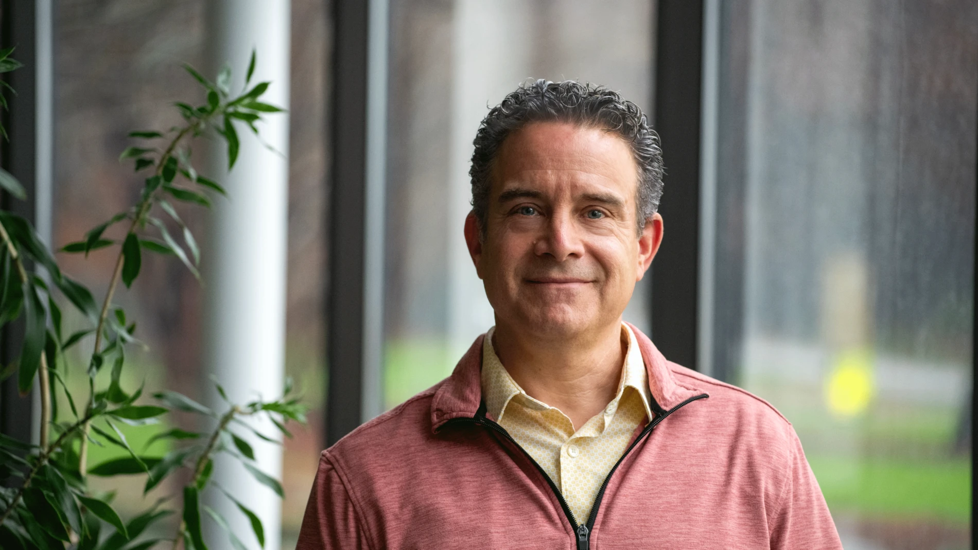 Guy-smiling-in-red-shirt