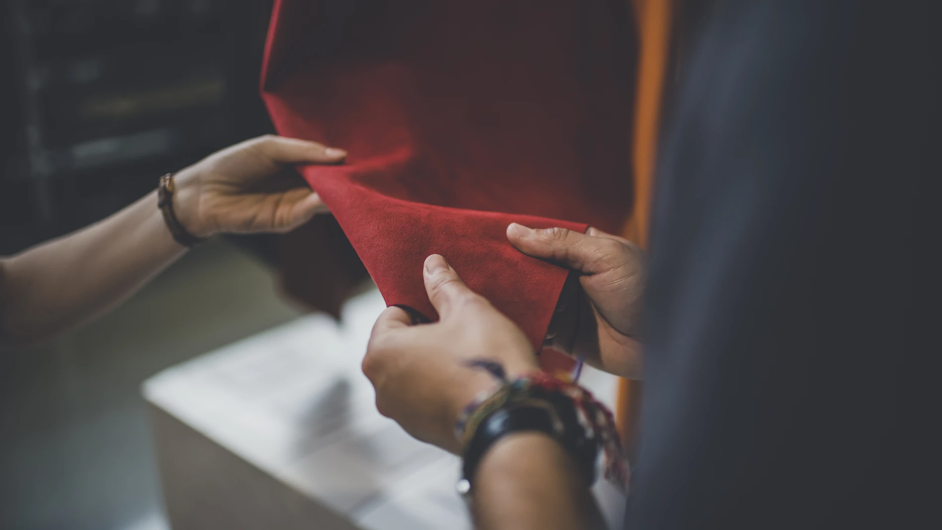 Hands touching leather