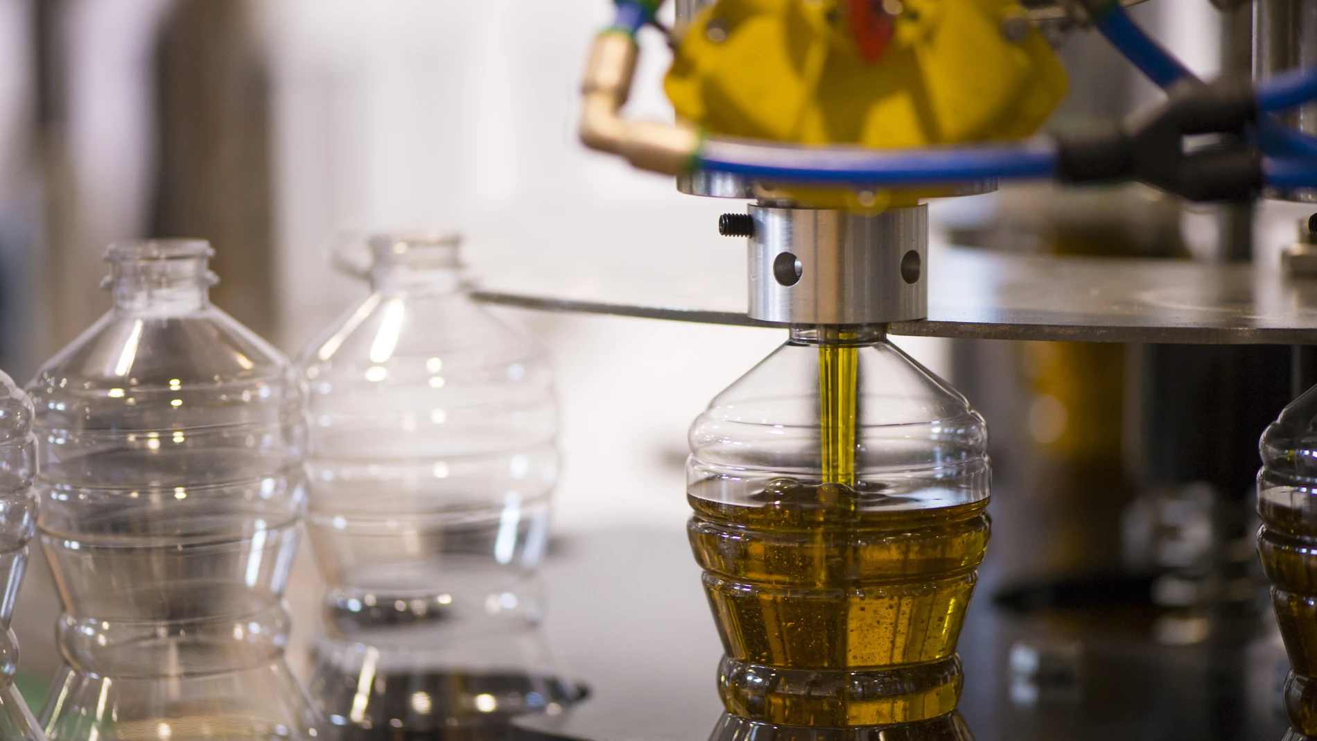 Oil bottle being filled up