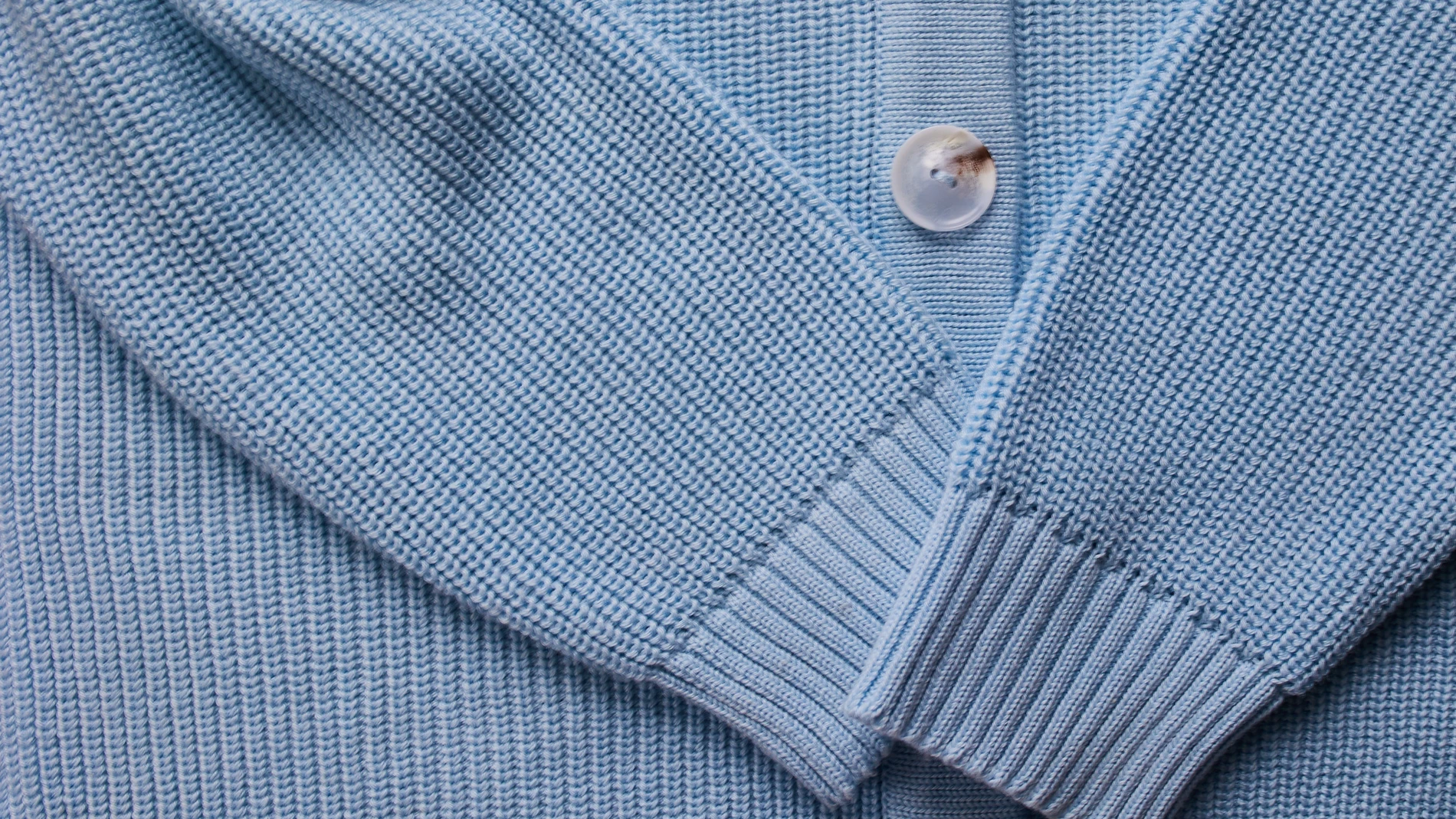 button of a blue jumper