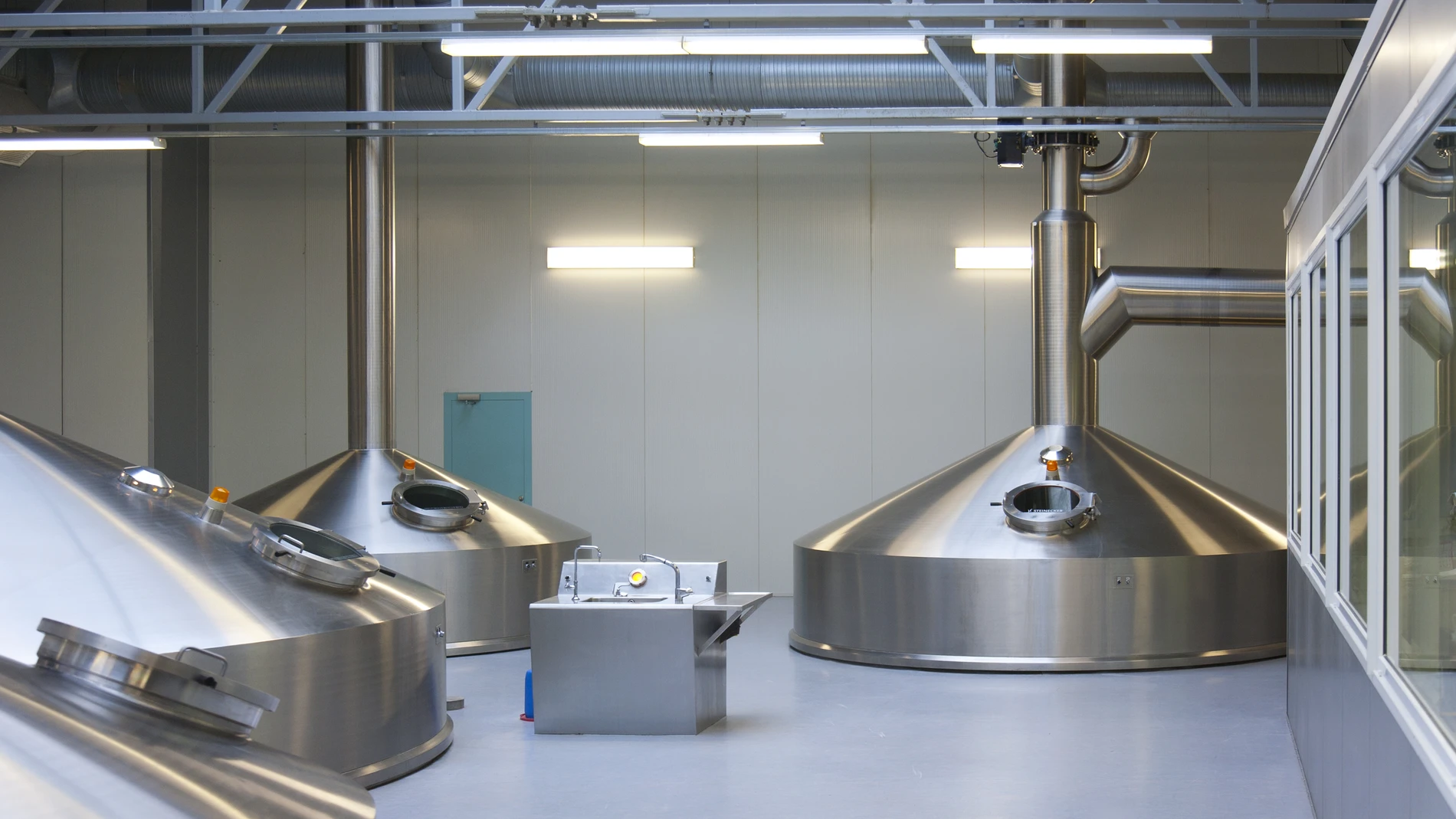 Interior of brewery large steel tanks