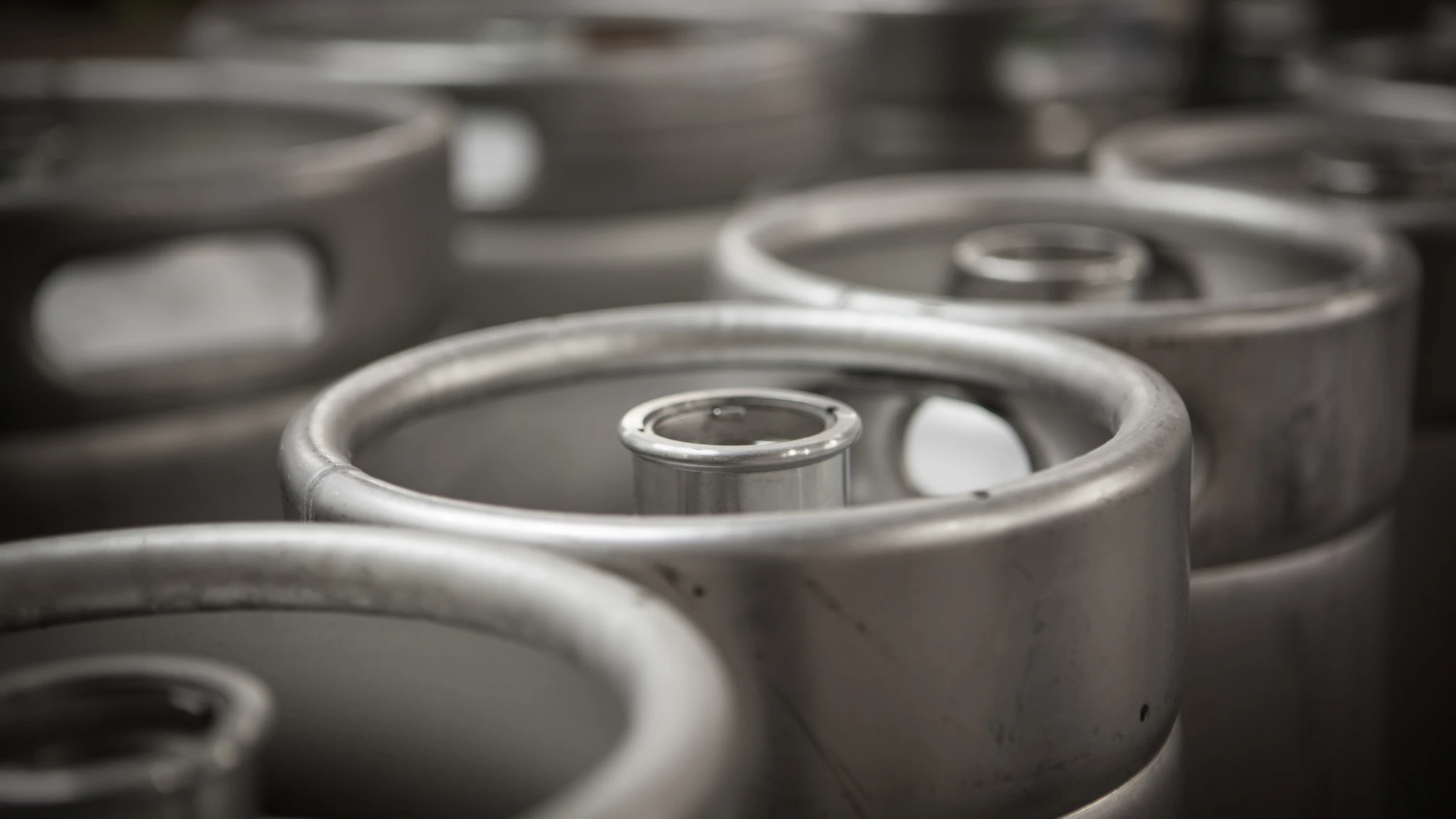 Closeup of steel barrels with beer